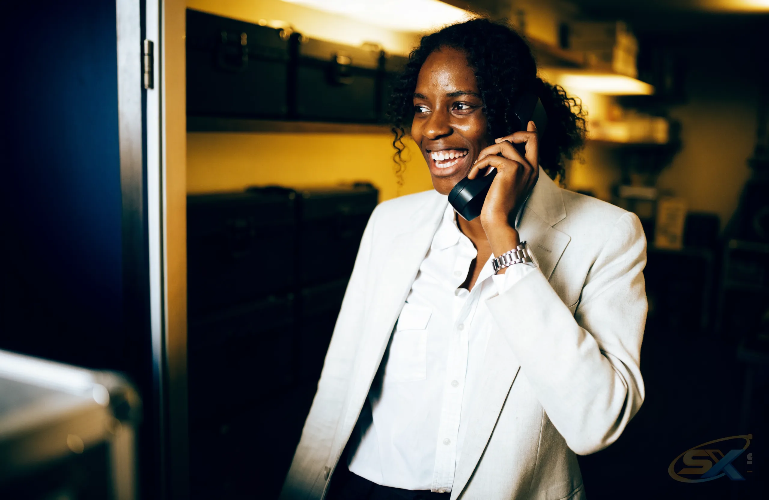 A person answering a customer call in a real office